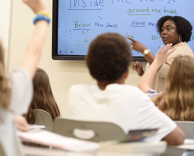 Photo of teacher calling on a student in a classroom