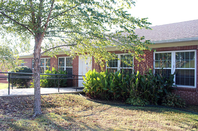 Photo of the red brick Arkansas CARES residential cottage